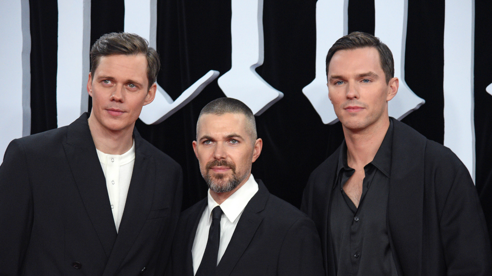 A press photo for "Nosferatu" with actor Bill Skargard, director Robert Eggers, and actor Nicholas Hoult