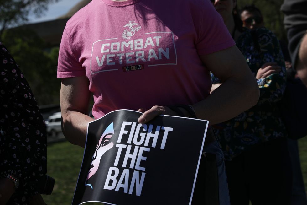 Activists participate in a rally at the Reflecting Pool of the U.S. Capitol April 10, 2019 in Washington, DC. Democratic lawmakers joined activists to rally against the transgender military service ban. 