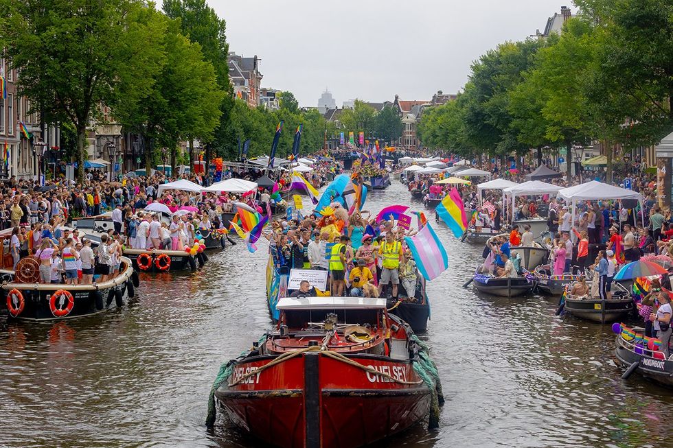 AMSTERDAM, THE NETHERLANDS lgbtqia Pride parades boat in canal rainbow flags