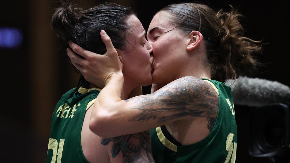 Australian 3x3 basketball players Anneli Maley and Merna Whittle celebrate a victory at an Olympics qualifier