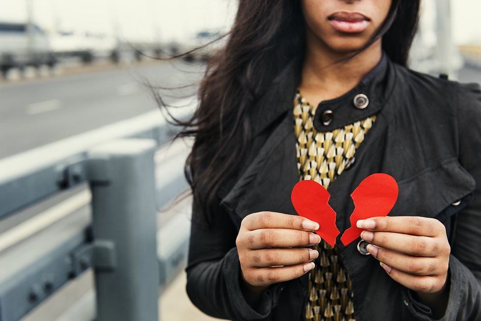 black woman with a torn heart