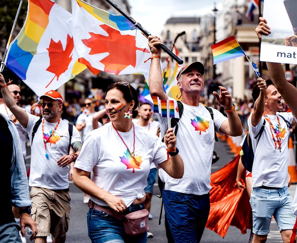 Canada embassy with flags and banners celebrating LGBTQ Pride Parade