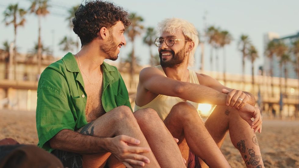 gay men flirting on the beach