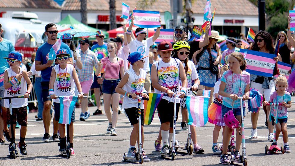 kids razor scooters pride parade flags rainbow shirts san diego ca
