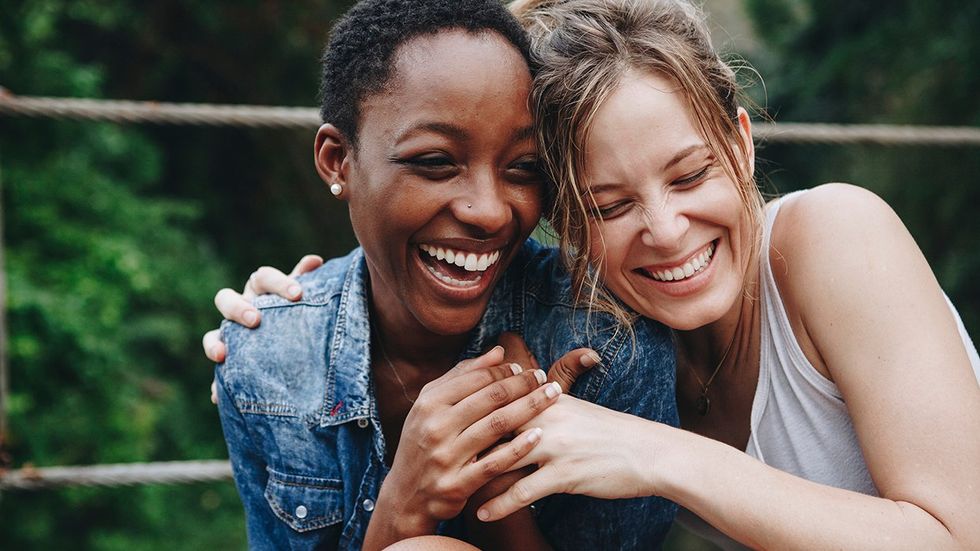 lesbian couple on a date hug