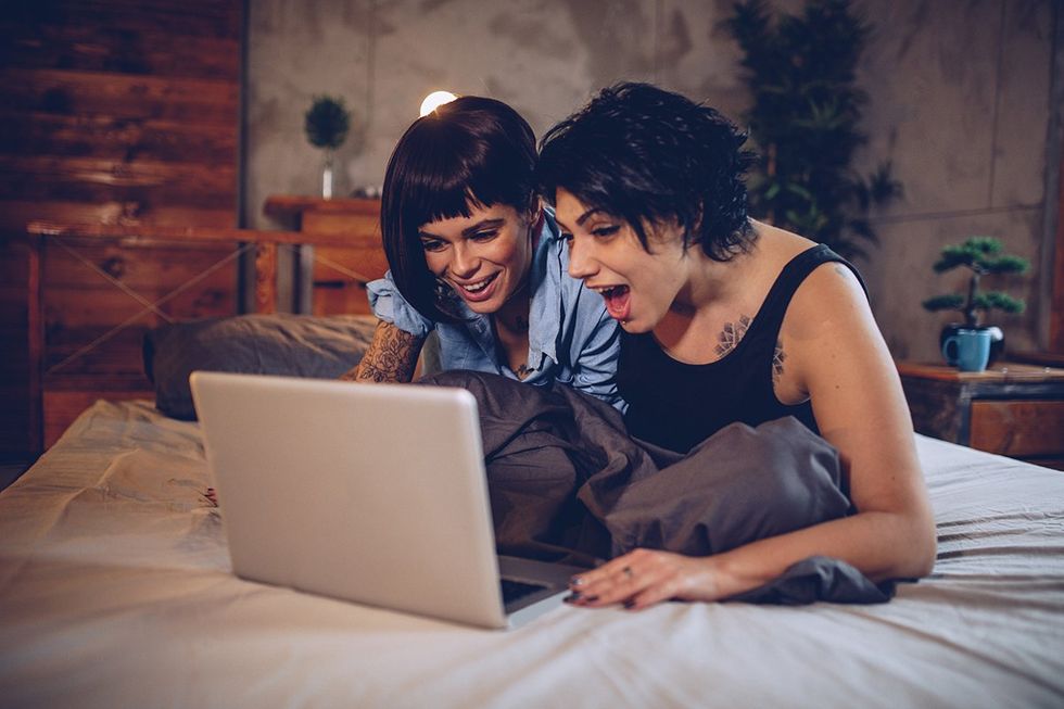 lesbians laughing at laptop