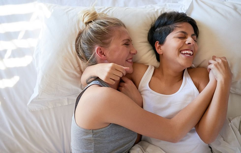 lesbians laughing in bed