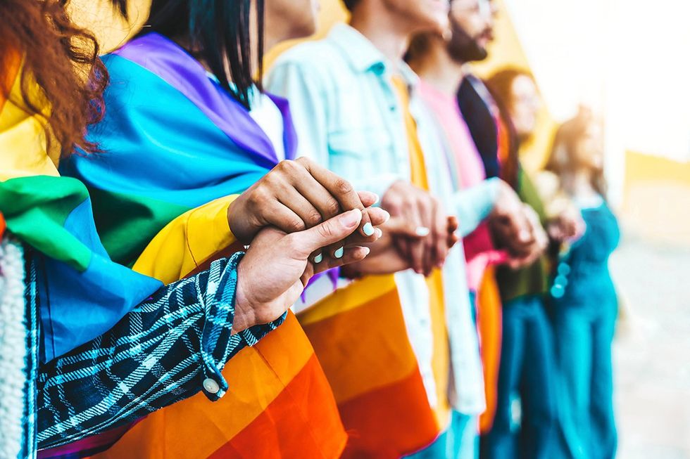 lgbtq+ people holding hands