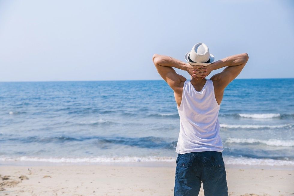 man looking out at the ocean