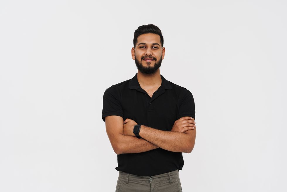 man standing with his arms crossed