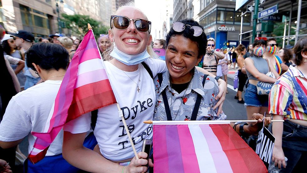 Marchers with lesbian flags 29th Dyke March June 2021 New York City fifth avenue queer parade