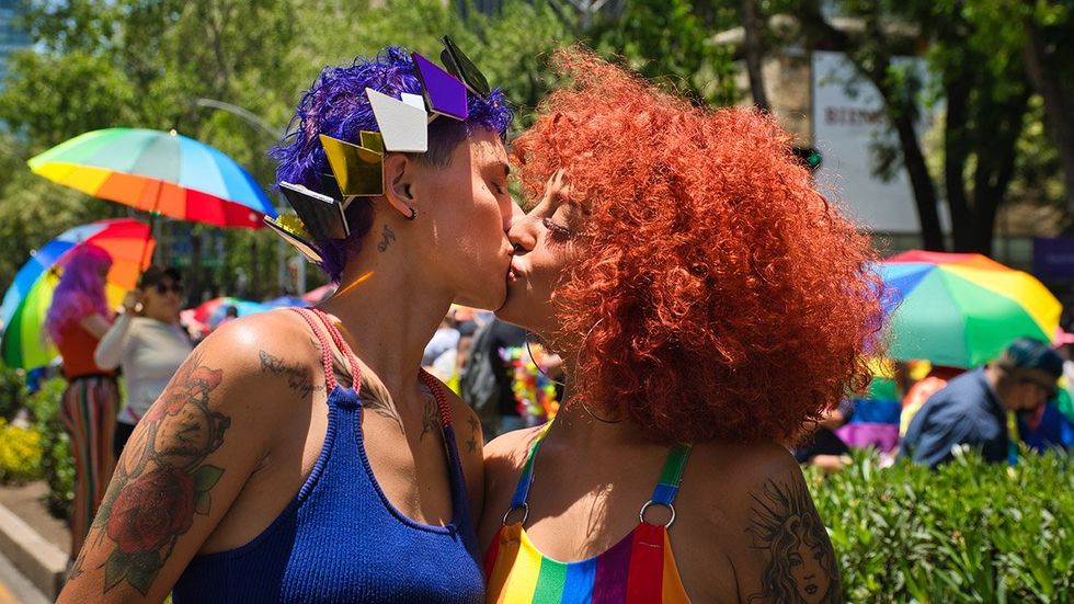 queer couple kiss at pride