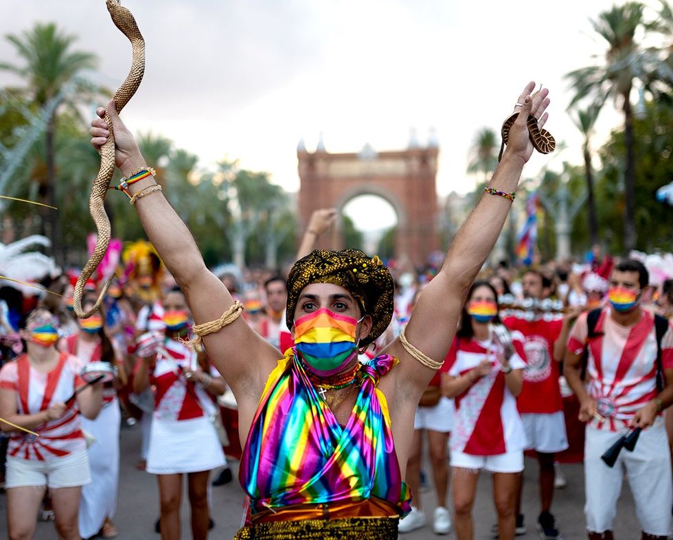 rainbow dancer at LGBTQIA Pride parade in Barcelona Spain