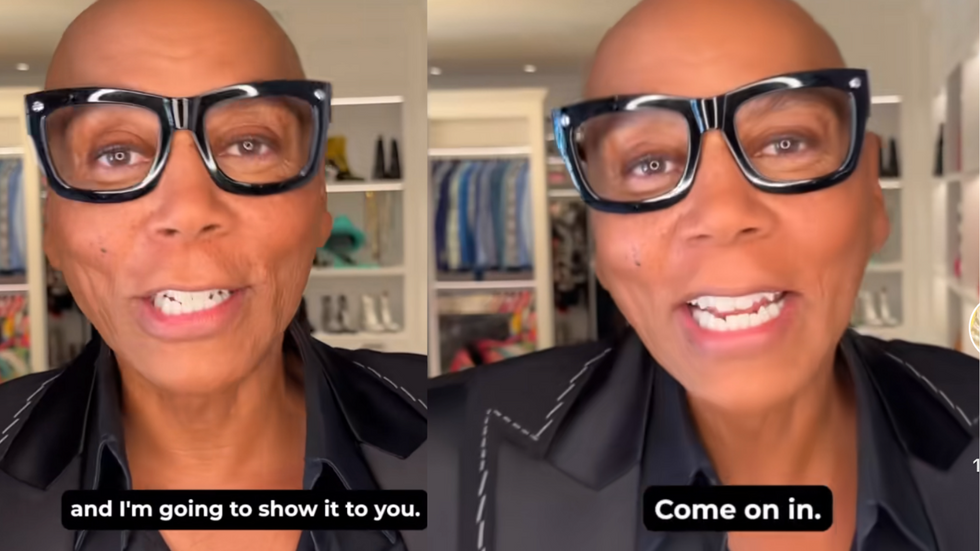 RuPaul Charles out of drag in a black suit and black glasses.