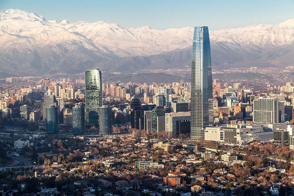 Santiago de Chile city and the Cordillera de los Andes mountains covered with snow in the background