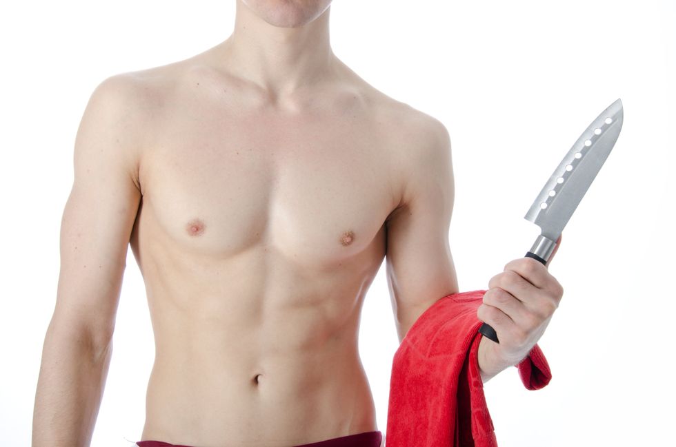 shitless man holding a towel and a knife