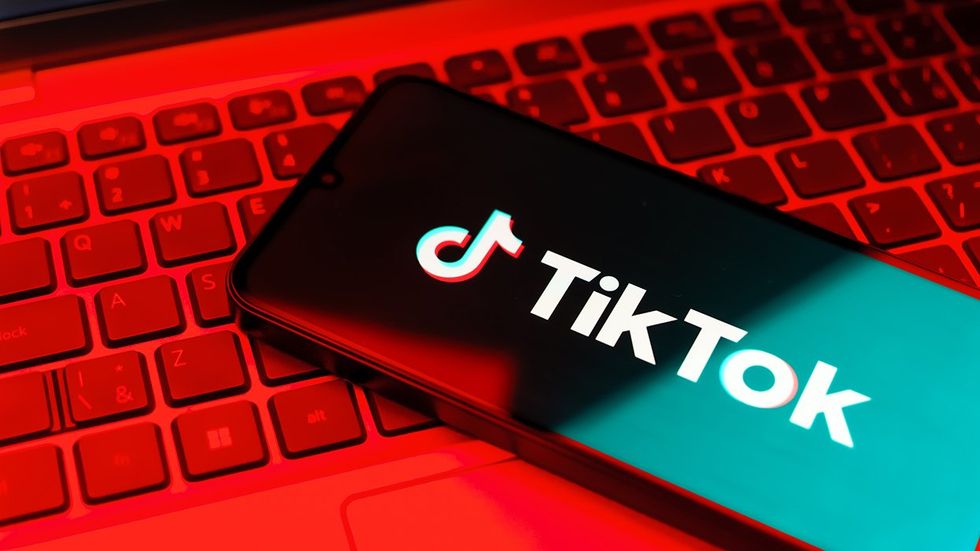 Smartphone laptop TikTok logo