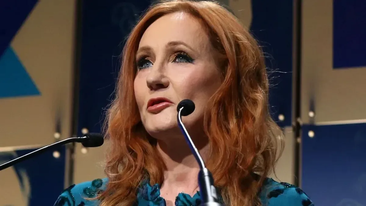 sourpuss JK Rowling accepts an award onstage