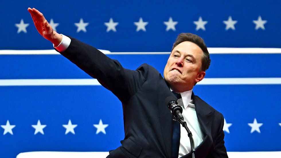 Tesla and SpaceX CEO Elon Musk gestures as he speaks during the inaugural parade inside Capitol One Arena, in Washington, DC, on January 20, 2025.