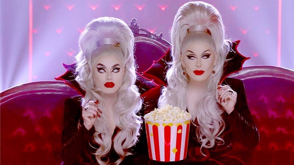 The Boulet brothers eating popcorn in a theater