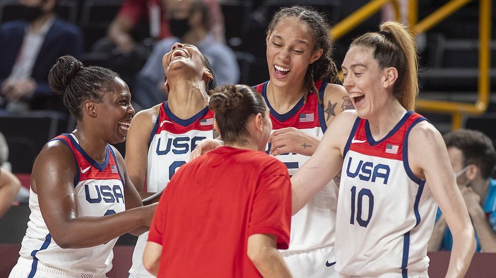 TOKYO, JAPAN August 8: Five time olympic gold medalist Diana Taurasi #12 of the United States is congratulated by Chelsea Gray #8 of the United States, Brittney Griner #15 of the United States, A'ja Wilson #9 of the United States and Breanna Stewart #10 of the United States during the Japan V USA basketball final for women at the Saitama Super Arena during the Tokyo 2020 Summer Olympic Games on August 8, 2021 in Tokyo, Japan.