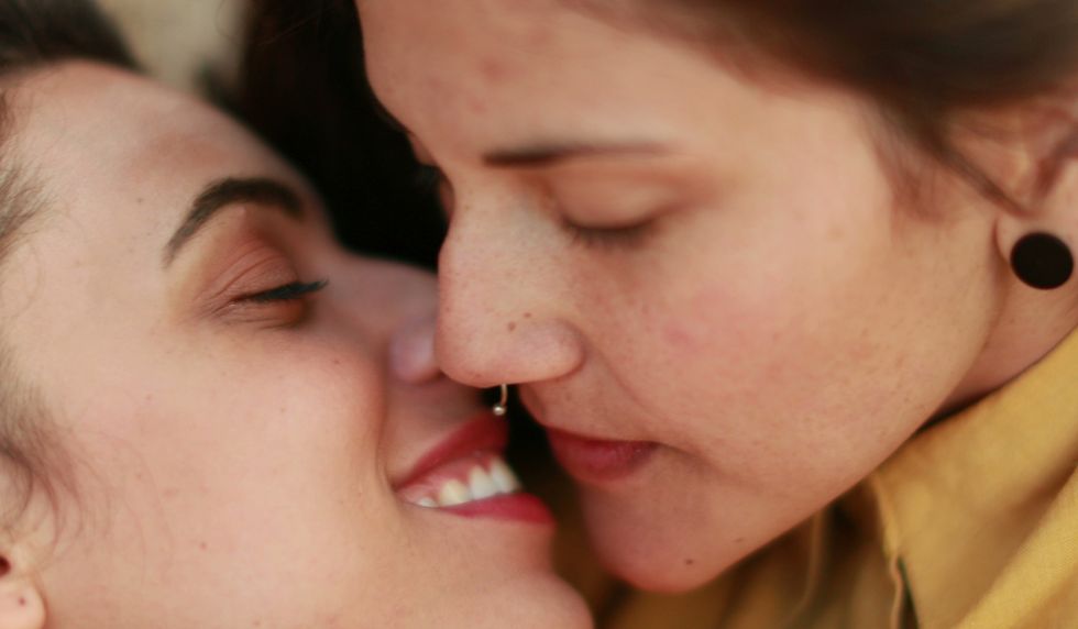 Two lesbians kissing