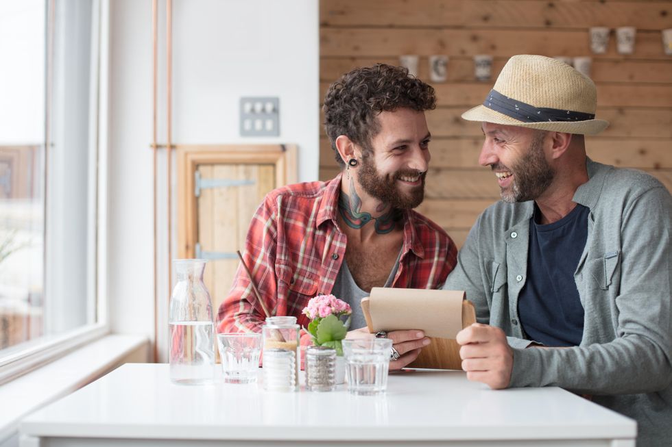 two men at a restaurant on a date