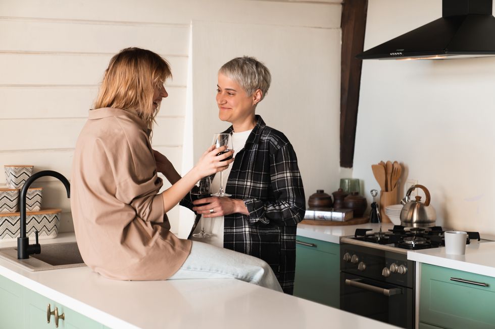 Two women in a kitchen talking