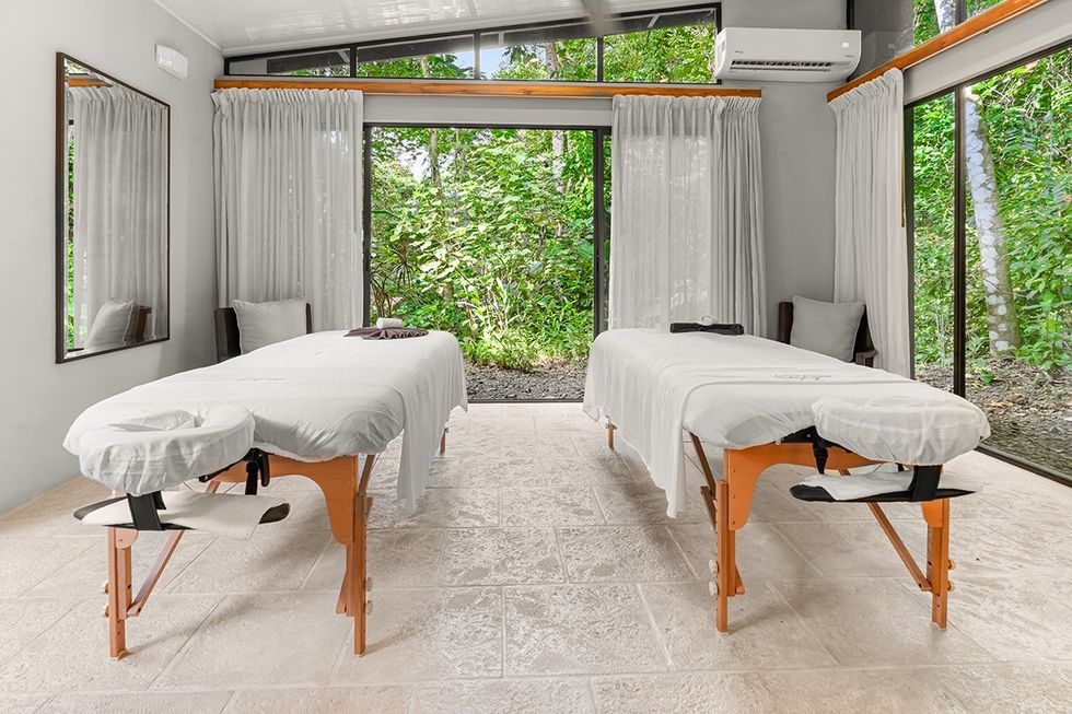 \u200bThe massage center at the Hotel Three Sixty opens to the rainforest