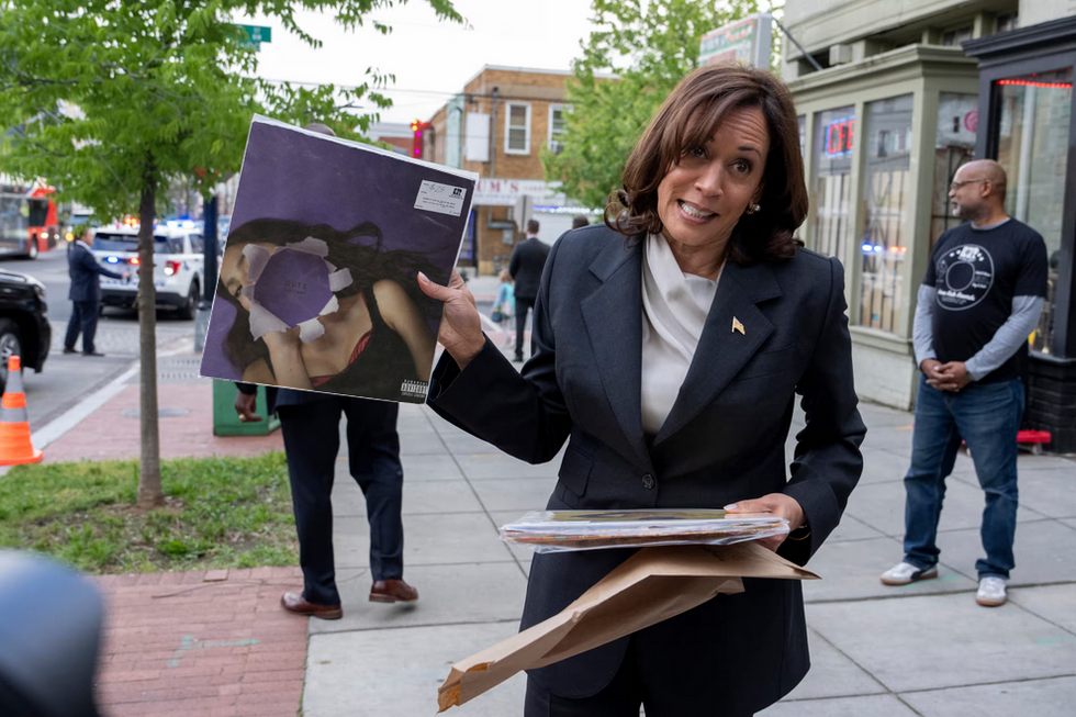 Vice President Kamala Harris holding a vinyl copy of the album "Guts" by Olivia Rodrigo