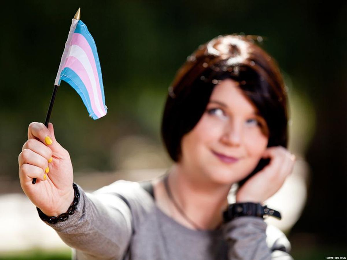 woman holds flag